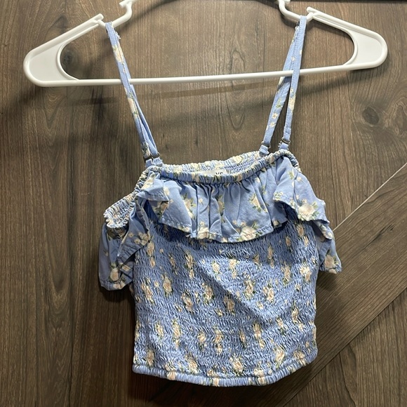 A blue floral print crop/tank top. Size: XS Color:Blue - Picture 1 of 2